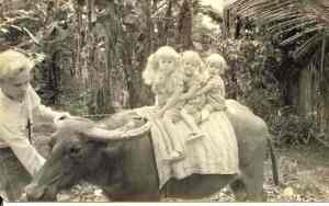 Me leading my sisters on a carabao in Bukidnon in the Philippines