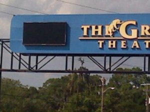 The sign that is a feature of the city announcing showtimes is dark